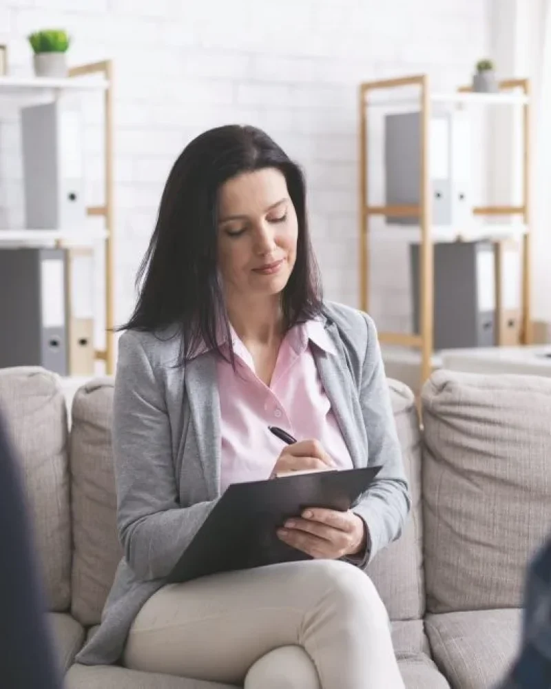 professional-psychologist-taking-notes-at-couple-meeting-with-patients